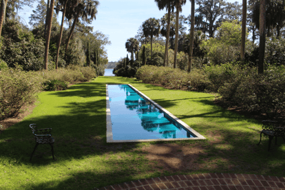 A long pool surrounded by lush nature and grass at a park in Tallahassee, Florida.