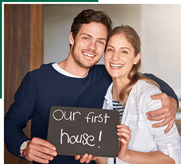 Happy couple after buying their new home