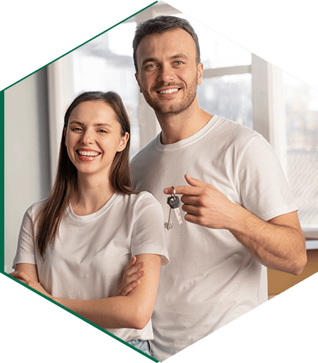 Happy couple showing their new house key