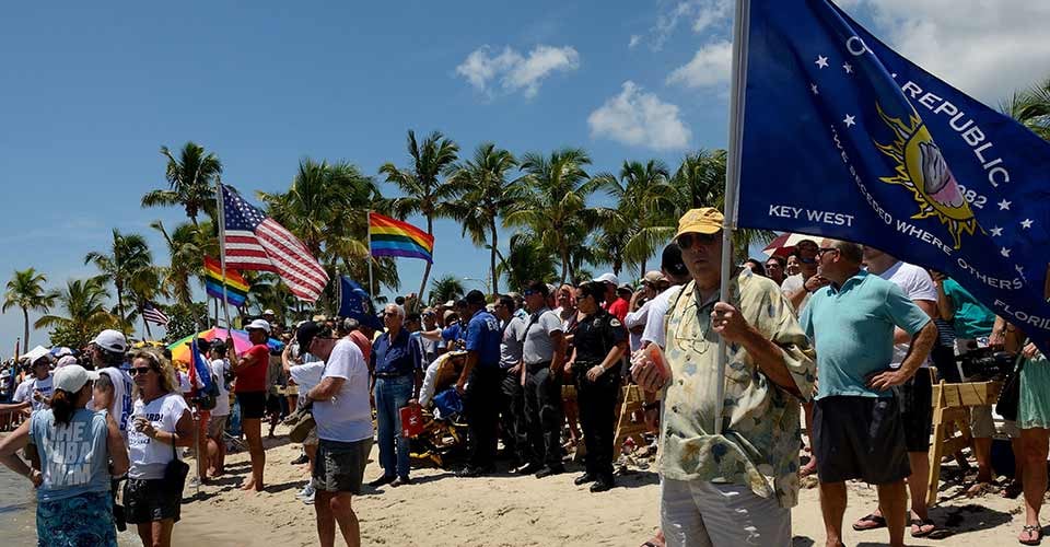A crowd gathers on Smathers Beach in Key West Florida