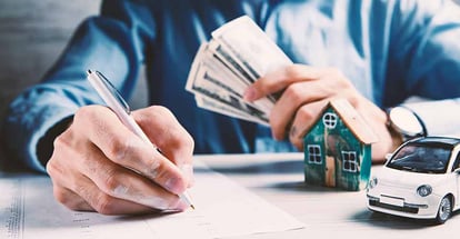 A customer signing a contract for home equity loan