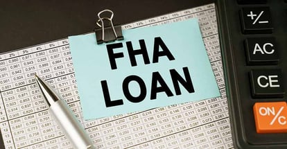 A financial report and sticker with the inscription FHA Loan