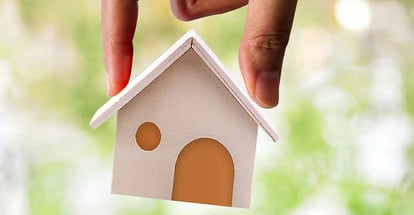 A hand hold a home model