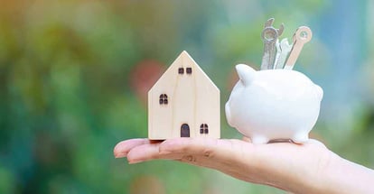 A hand hold piggy bank with wrench tools for renovation and model house