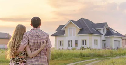 A loving couple looking at their new home