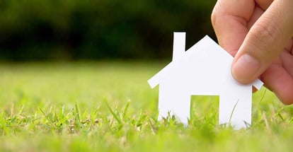 A paper house on a grass