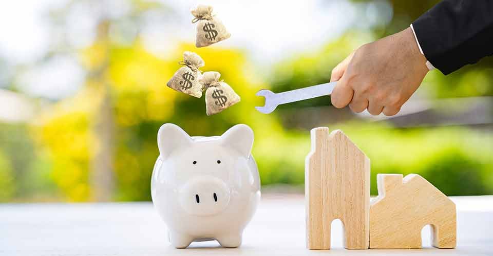 A person hand hold wrench and money for renovation