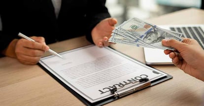 A person signing a contract and accept cash offer for home