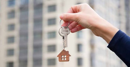 A real estate agent holding a house key