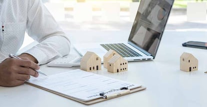 A real estate investor sign home purchase agreement