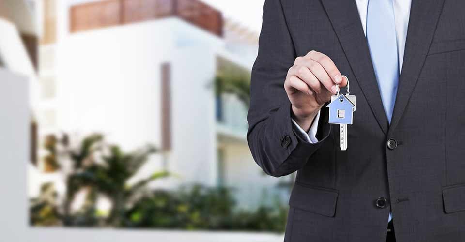 A realtor holding a new house key