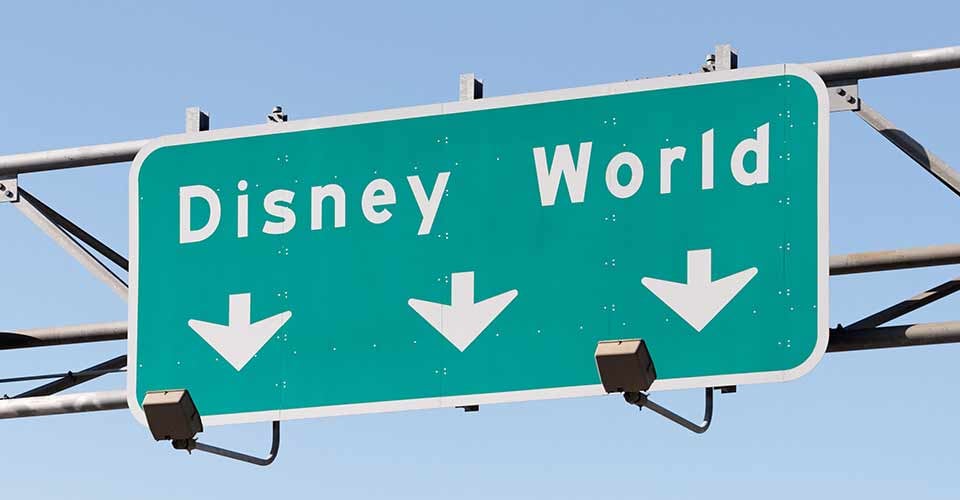A sign in Orlando Florida points to the Walt Disney World Resort