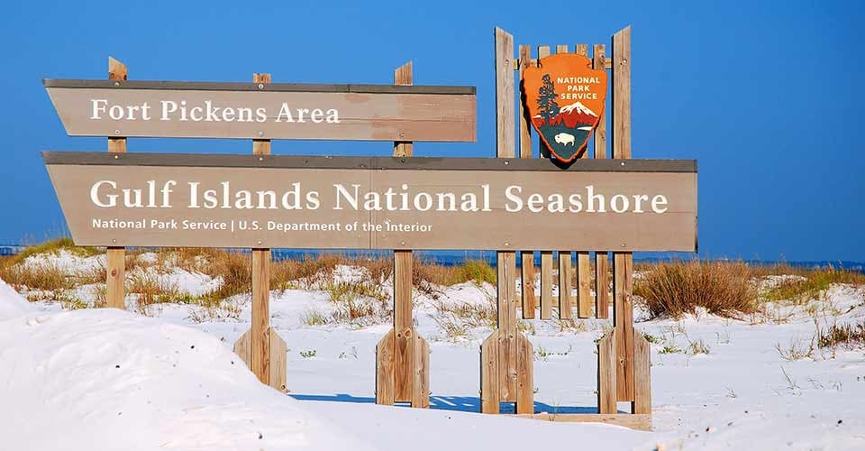 A sign welcomes visitors to the Gulf Islands National Seashore near Pensacola Florida