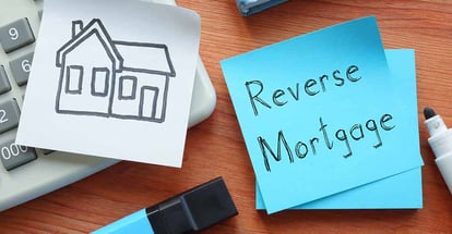 A sticky note with Reverse mortgage text
