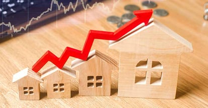 A upward red arrow above the wooden houses