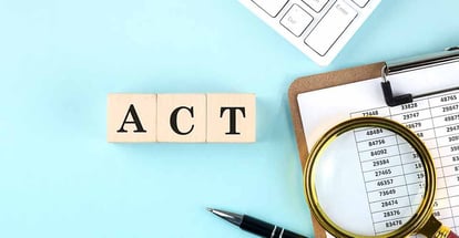 ACT word on wooden cubes with chart and keyboard