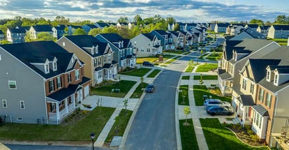 Aerial view of classic upper middle class neighborhood street with luxury single family homes in Florida