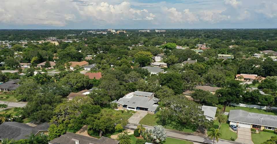 Aerial view of neighbourhood with lots of water and trees in Florida