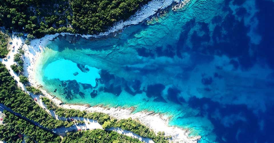 Aerial view of tropical Caribbean bay with white sand beach and beautiful turquoise sea