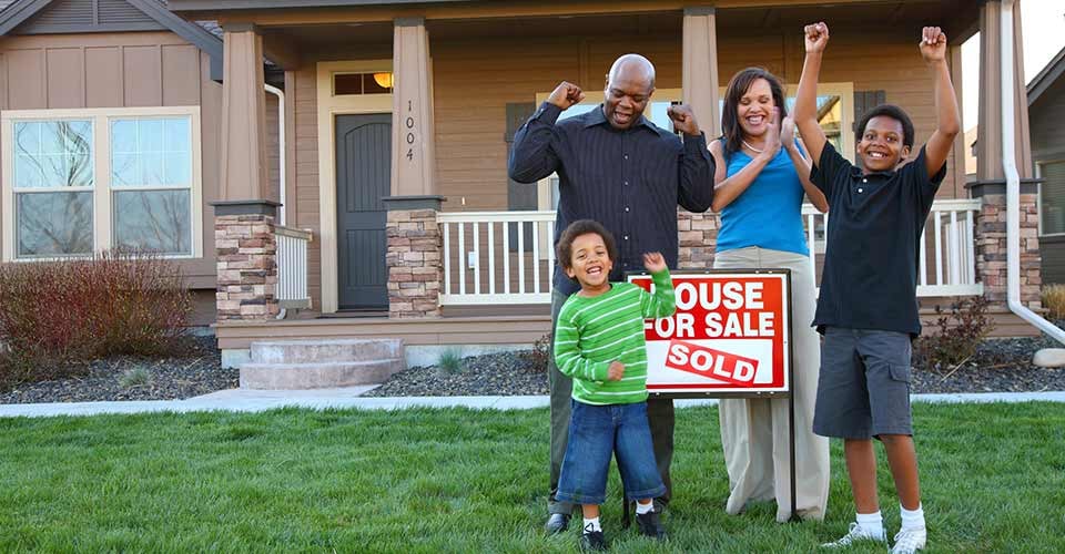 African American family celebrates new home purchase