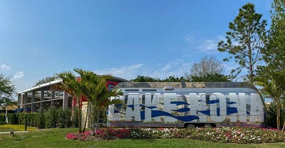 An Airstream Trailer that is painted with the words Lake Nona in Orlando Florida