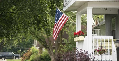 An American home proudly displaying their flag for a patriotic holiday