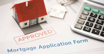 Approved mortgage loan agreement application and model house