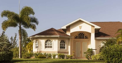 Beautiful concrete block and stucco home in the countryside with trees in Florida