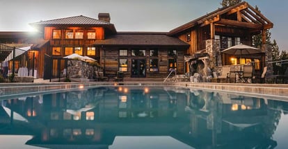 Brown Wooden House Infront of Swimming Pool Under Blue Sky