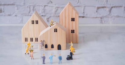 Construction miniature workers team working on house renovation