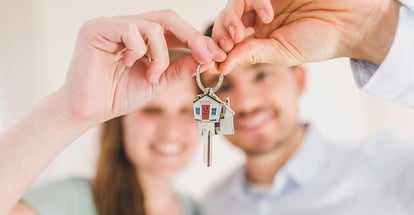 Couple Holding House Key