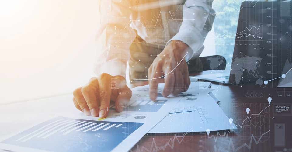 Documents on office table with smart phone digital tablet and graph