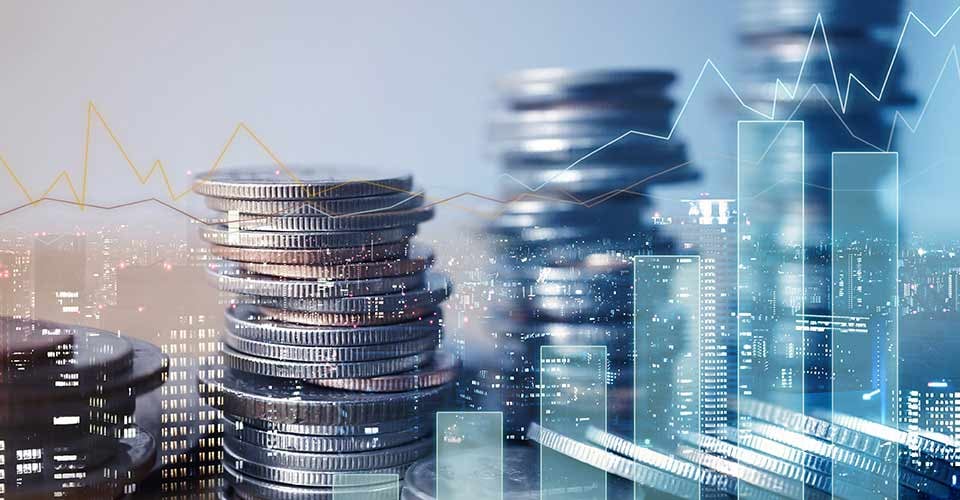 Double exposure of city with row of coin stack with growth chart