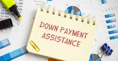 Down Payment Assistance phrase written on notebook