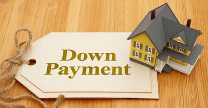 Down Payment written on tag with a model house