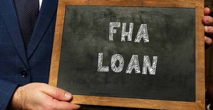 FHA Loan inscription on black chalkboard