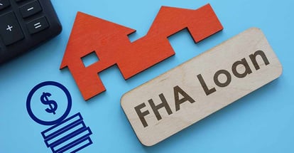 FHA Loan text on wooden plank and model house