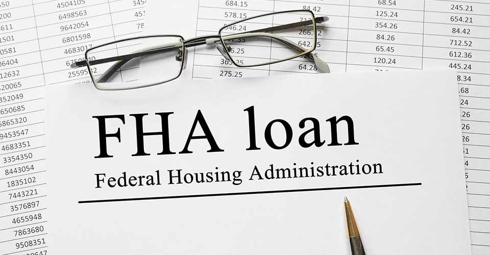 FHA loan documents on table