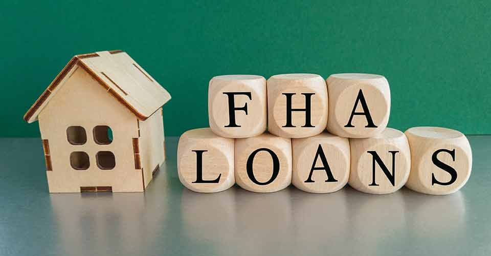 FHA words on wooden cube and house model