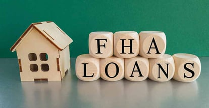 FHA words on wooden cube and house model