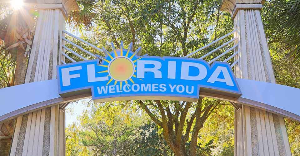 Florida Welcomes You Sign against the bright sun
