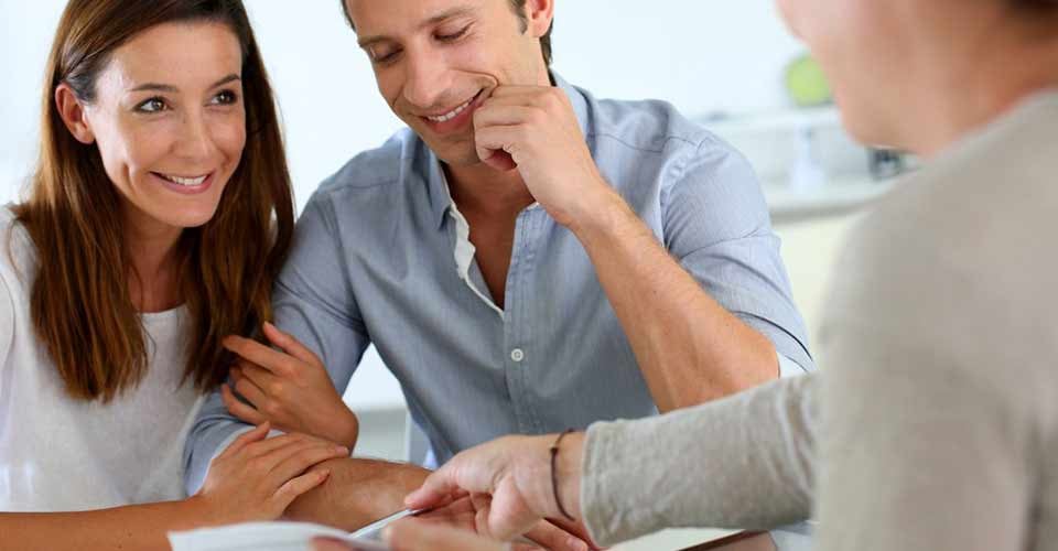 Future property owners reading terms of contract