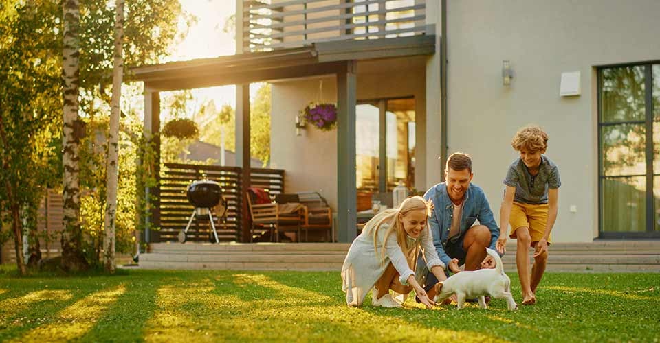 Happy Family with Dog have Fun at Suburban House Backyard