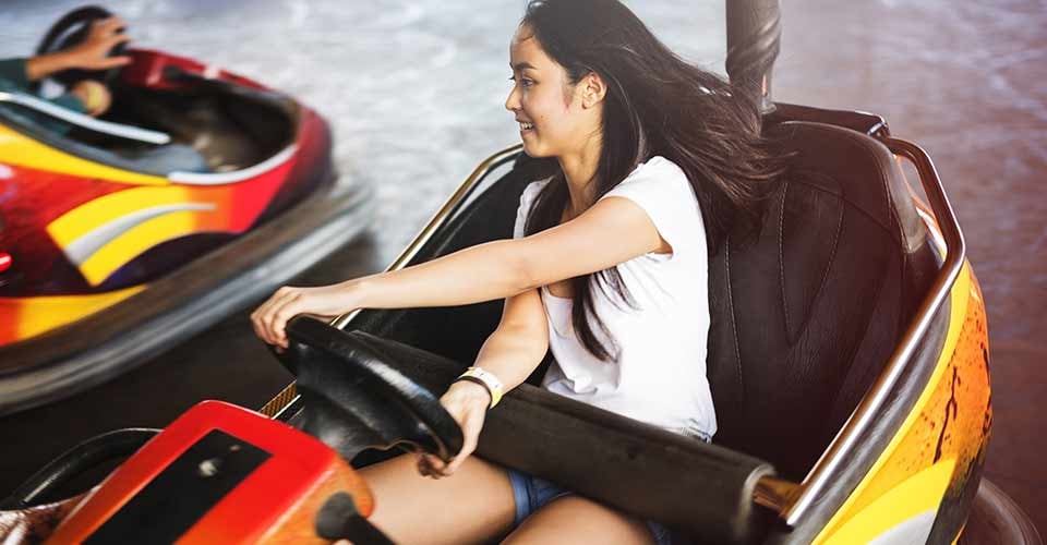Happy Girl Driving Bumper Car