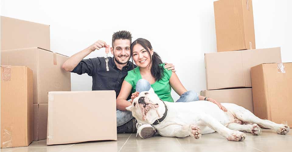Happy couple moving to new home