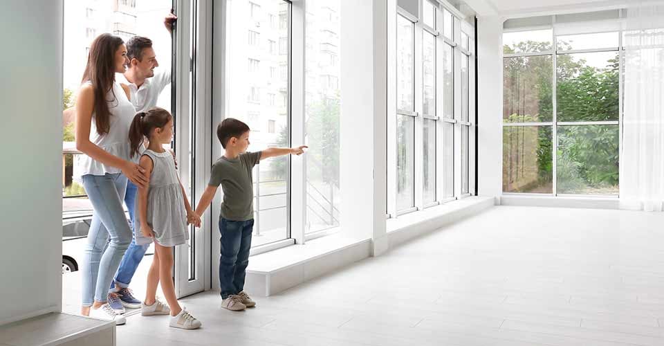 Happy family entering new house