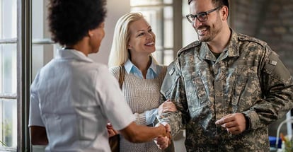 Happy military man shaking hands