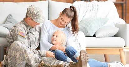 Happy military man with his family at new home