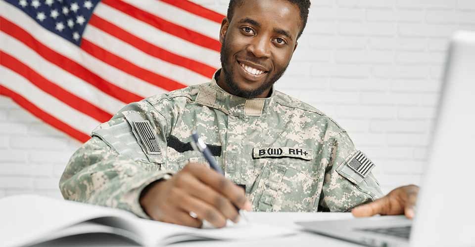 Happy soldier signing a home purchase contract