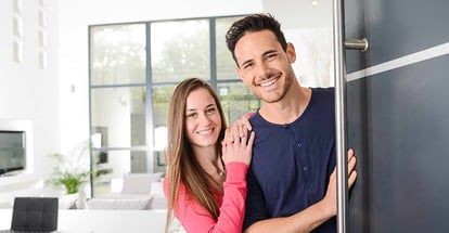 Happy young couple at their new house